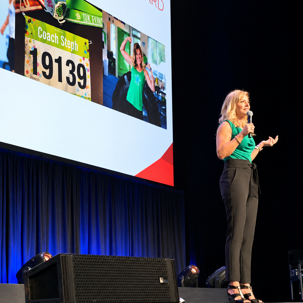 Coach Steph Ward speaking on stage